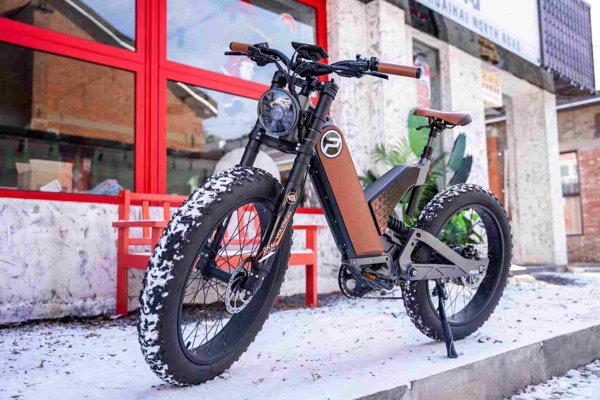 Electric fat tire bike with oversized tires parked outdoors showcasing all-terrain adventure cycling capabilities and robust design.